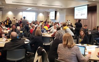 Conference room filled with planners for Wichita State University
